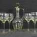 A Beautiful Antique Carafe And Four Wine Glasses