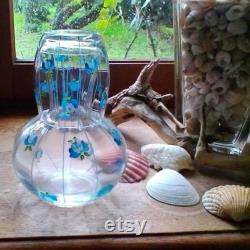 A beautiful vintage painted glass night set carafe and glass carafe de nuit decorated with blue flowers