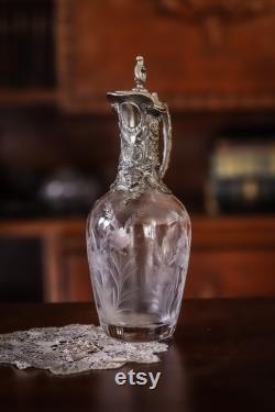 A late 19th century antique carafe with putti head