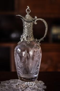 A late 19th century antique carafe with putti head