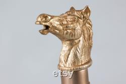 A set of two vintage brass horse head carafes.