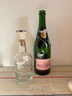 An elegant versatile French 37.5 cl capacity glass, carafe, bottle with a ceramic blue and white push in cork stopper