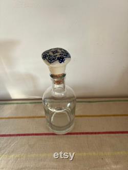 An elegant versatile French 37.5 cl capacity glass, carafe, bottle with a ceramic blue and white push in cork stopper