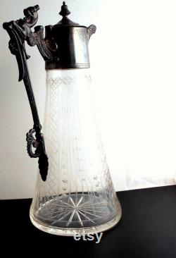 Carafe glass metal mount. Vol. 800 ml. Total H. 28.5 cm. W. 15.5 cm. Starcut under round stand. . 13 cm. Undamaged original.