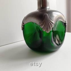 Chunky and heavy glass green glass and pewter carafe wine decanter with stopper.