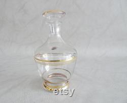 Glass carafe with glasses and mirror tray