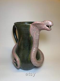 Hamdmade ceramic carafe with snake.