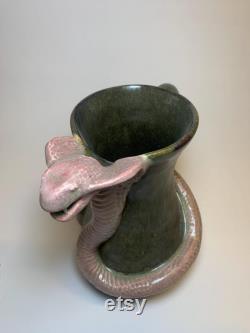 Hamdmade ceramic carafe with snake.