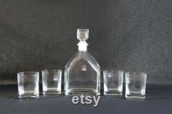 Mid-century light and music whisky decanter with its cap and four shot glasses