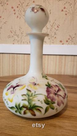Milk glass barber bottle with bright, beautiful flowers