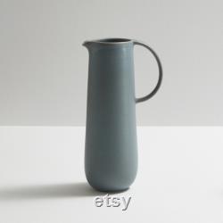Modern and timeless handmade ceramic carafe. Exceptionally handcrafted. Available in white, blue grey, sage green, grey, and black.