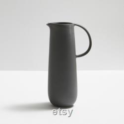 Modern and timeless handmade ceramic carafe. Exceptionally handcrafted. Available in white, blue grey, sage green, grey, and black.