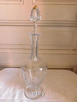 crystal decanter engraved with floral decor and foliage